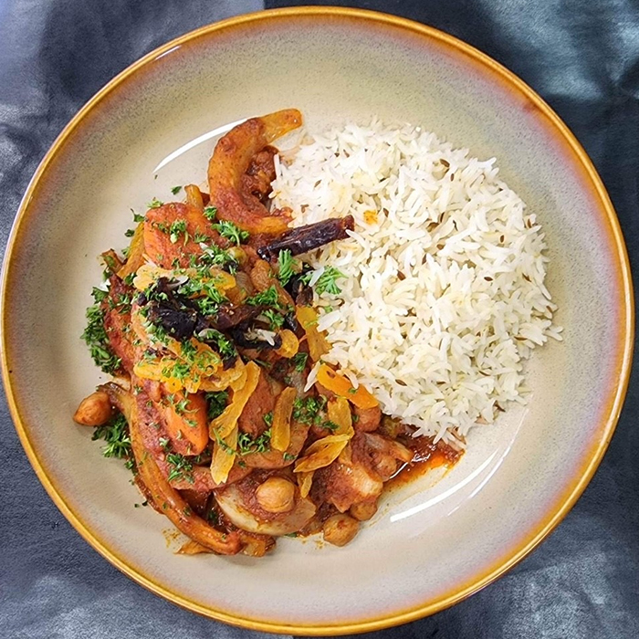 Moroccan tagine dish with rice on a plate