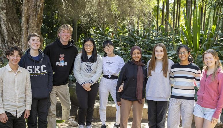 The nine members of Youth Advisory Board, happily posing together at Melbourne Zoo.