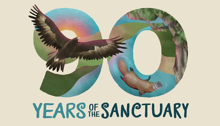 "Ninety Years Of The Sanctuary"; the water-coloured logo features a flying Wedge-Tailed Eagle on the Nine, a swimming Platypus and a eucalyptus tree on the Zero.